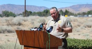 Sheriff Alex Villanueva speaks to press at podium