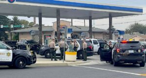 Sheriff's deputies detain a suspect at a Santa Clarita gas station.