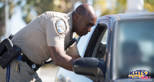 chp officer leaning into a car window
