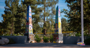 Four bouquets of flowers lay on the Obelisks