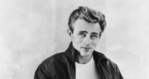 American actor James Dean (1931 - 1955) leaning against a wall on the set of director Nicholas Ray's film, 'Rebel Without a Cause', 1955. (Photo via John Kobal Foundation/Hulton Archive/Getty Images)